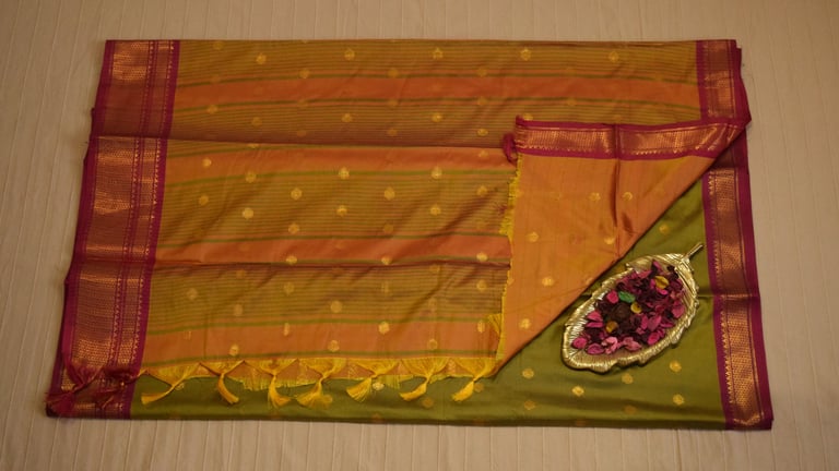 Elegant green Soft Silk Saree with golden motifs and pink border