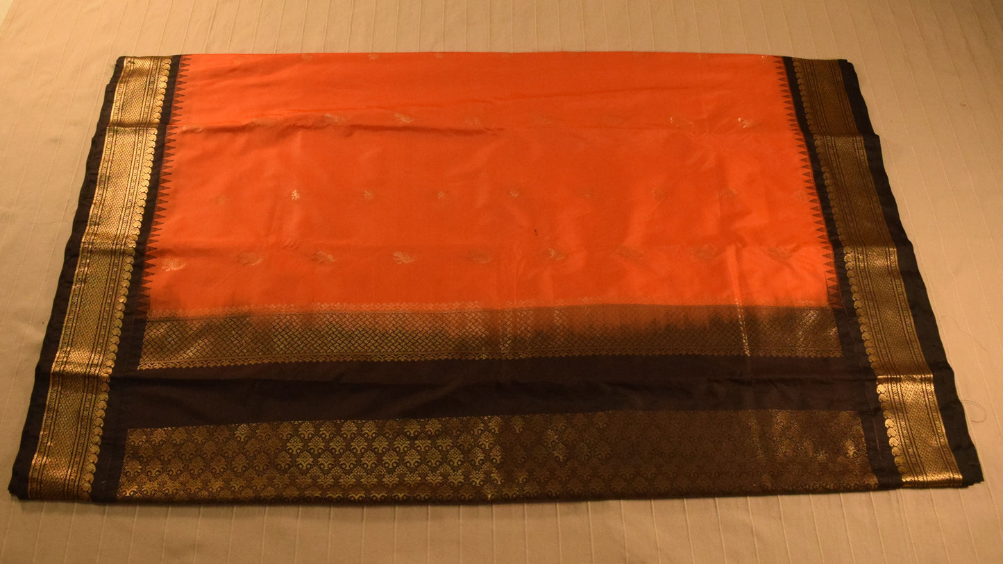 Vibrant orange and Black Semi Gadwal silk saree