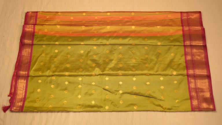 Elegant green Soft Silk Saree with golden motifs and pink border